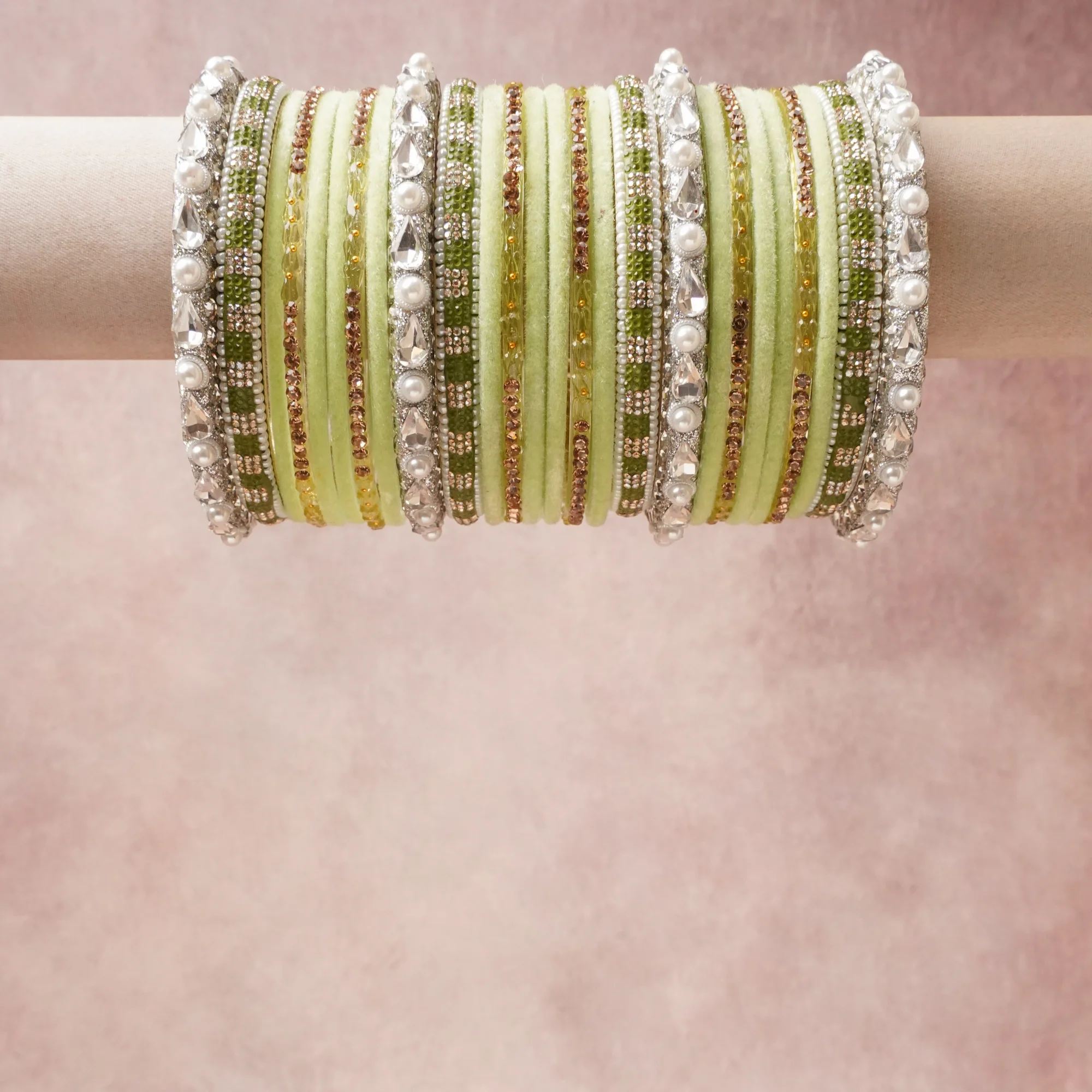 A grounding Pale Pistachio Green forms the heart of the set, while touches of Crystal Clear, Pearl White, Silver, Rose Gold, Olive Green add charm.

A thoughtful composition of Velvet, Rhinestone, Faux Pearl, Glass Beads, Silver-toned Base Metal, designed to feel complete without being heavy.
Each element layers seamlessly, creating a look that is refined, wearable and quietly striking.